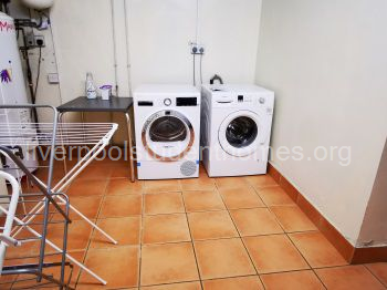 dedicated laundry room with seperate tumble drier, washing machine and lots of hanging space