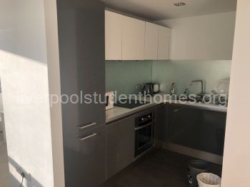 Kitchen with fridge, freezer, oven, hob, microwave, dishwasher, toaster and kettle